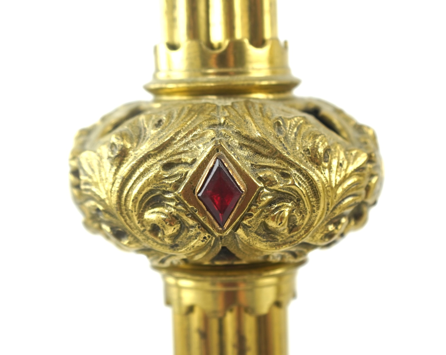 A set of four Gothic revival brass altar candlesticks